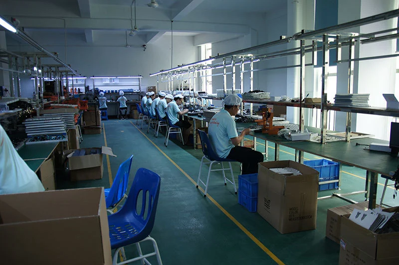 Image of workers making technology items production